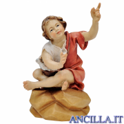 Bambino seduto al falò Ulrich serie 23 cm
